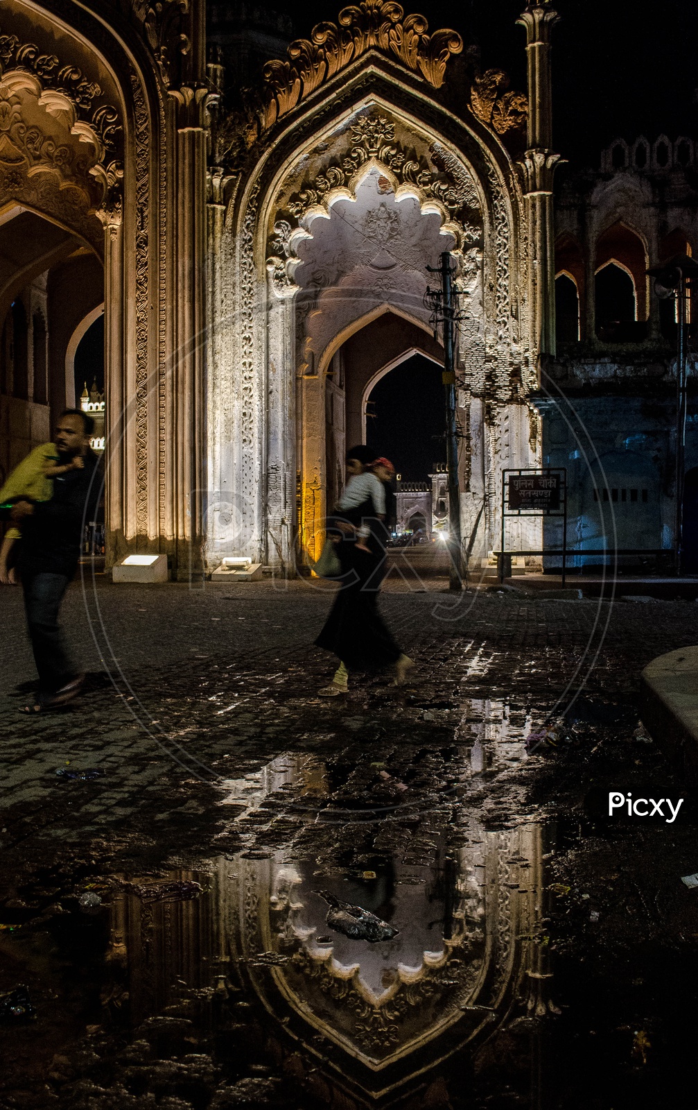 Image of Architectural Views Of Rumi Darwaza and Visitors inside The
