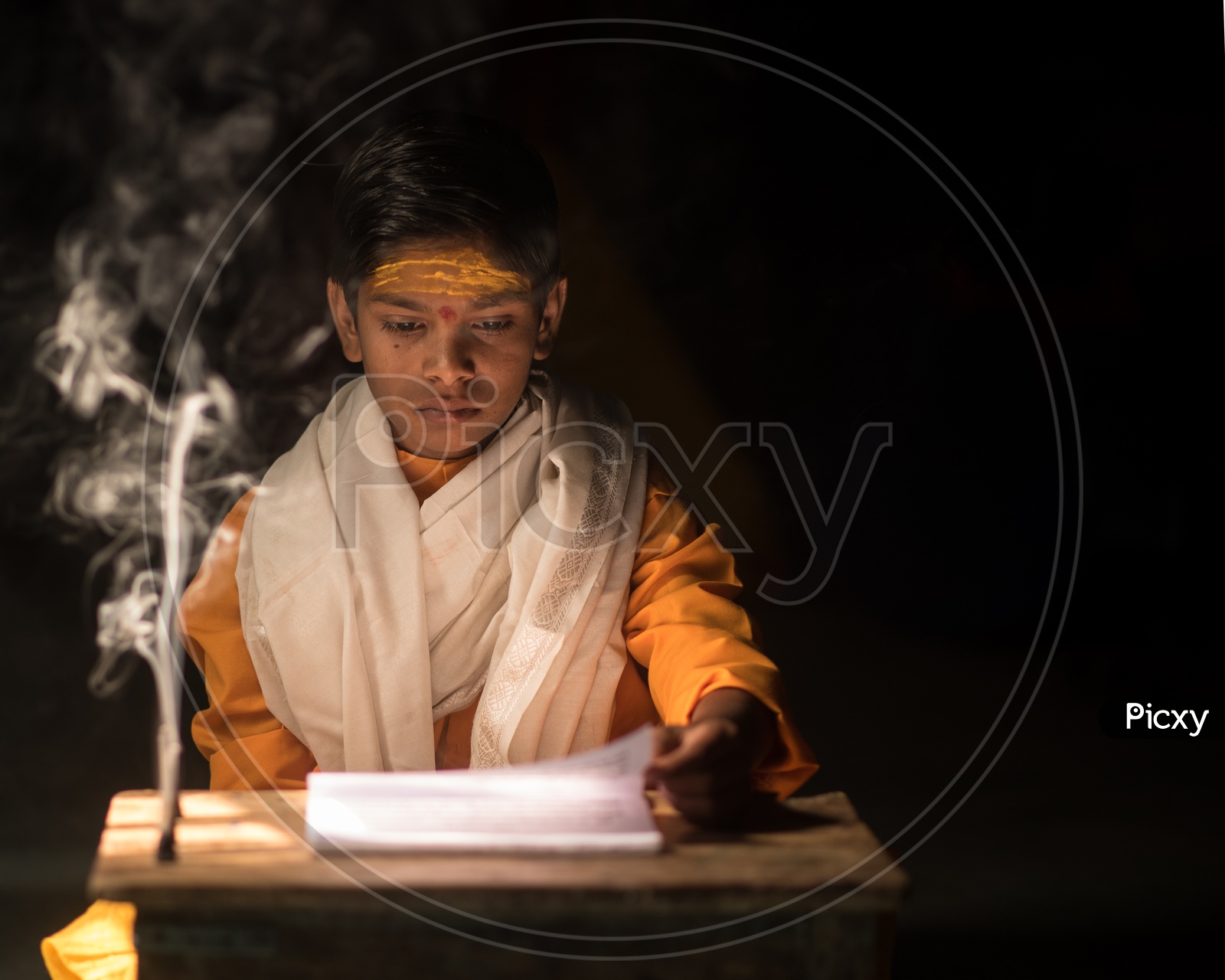 An Indian Boy Priest Reading Vedas