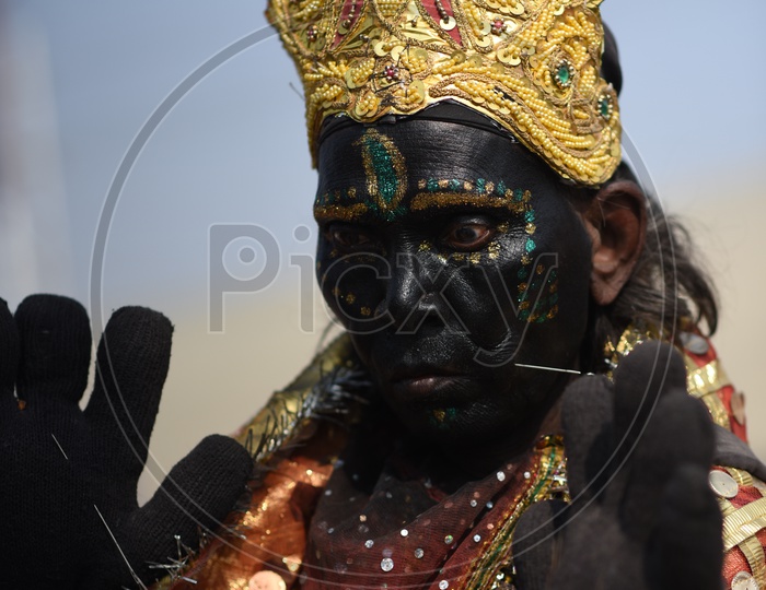 A Woman In Indian Goddess Kali Attire In Kumbh Mela