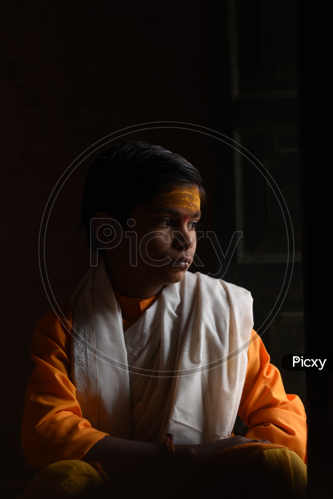 Portrait Of  A Young Indian Boy Priest
