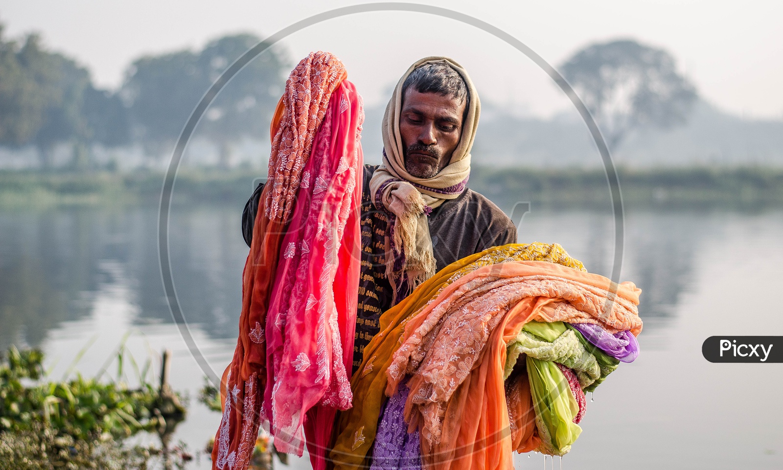 Clothes Washer Or Dhobi Washing Clothes In a Lake