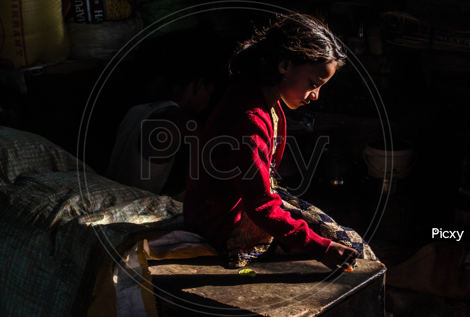 A Young Indian Girl Child In Rural Indian Village  House