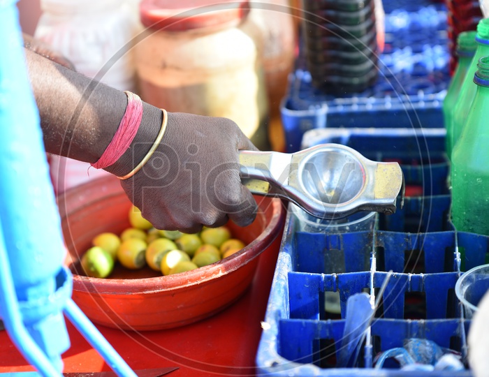 Street Vendor Preparing Lemon Soda At Roadside Stall