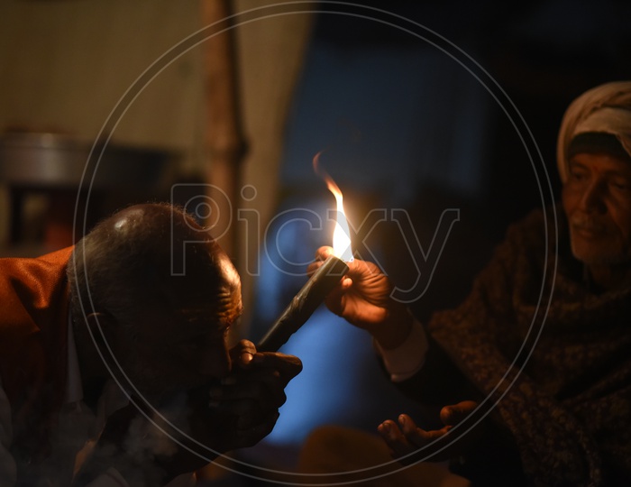 Indian Naga Sadhus Or Babas Or Aghoras  Smoking Weed Or Ganja  at Kumbh Mela