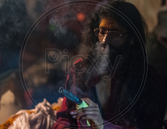 Indian Naga Sadhus Or Babas Or Aghoras  Smoking Weed or Ganja   at Kumbh Mela