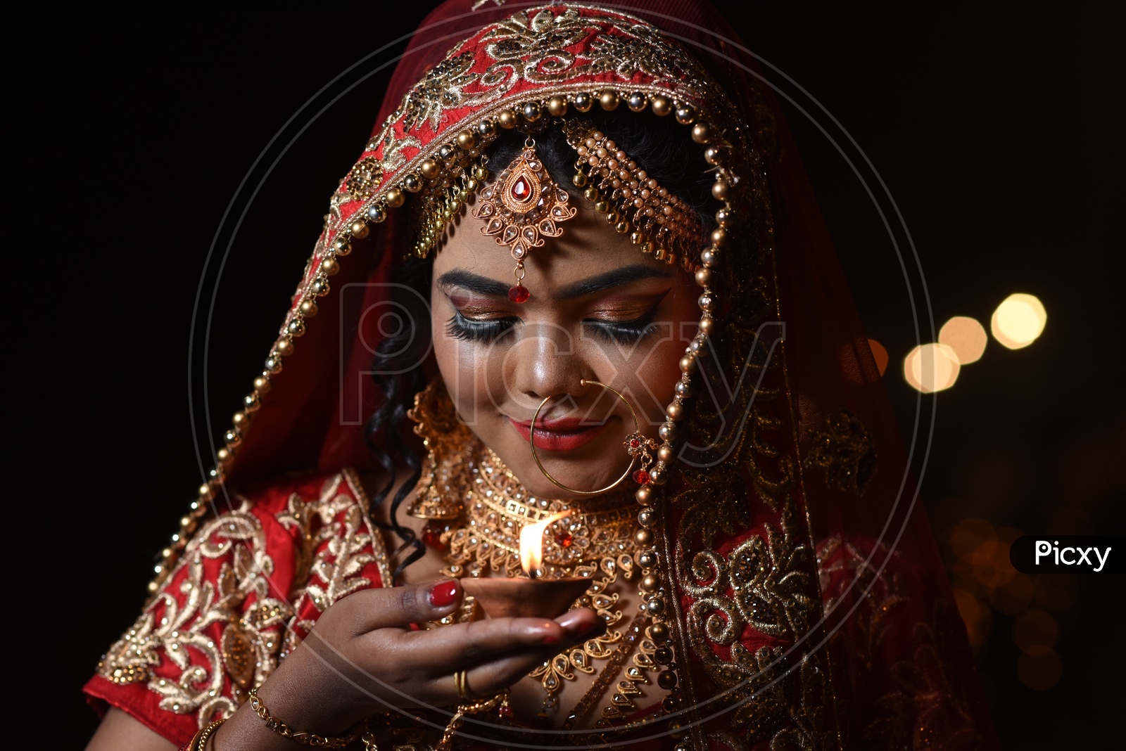 A Traditional Indian Woman  In Elegant Look With Diwali Dias and Posing