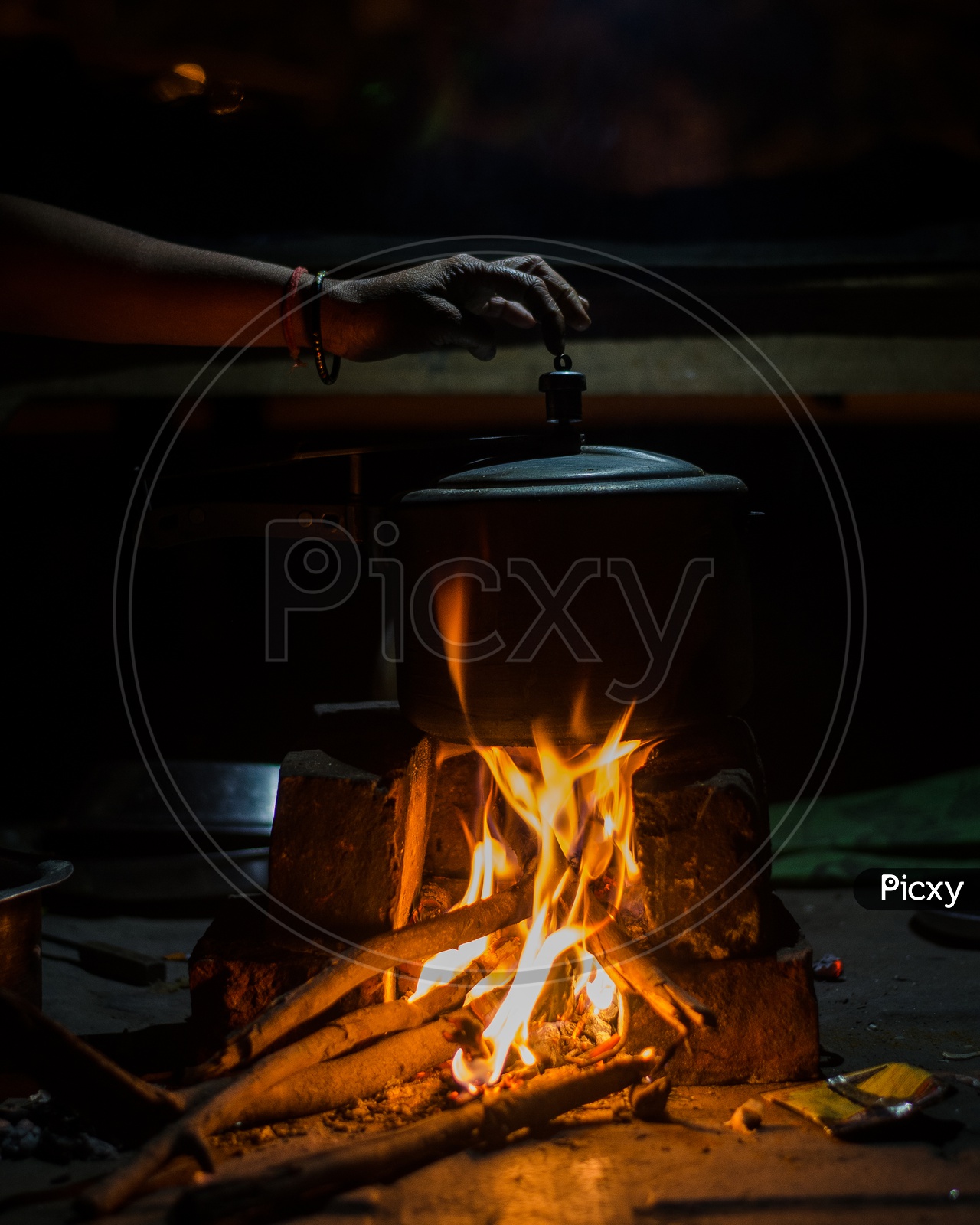 Cooking In a Rice Cooker On a Rural Traditional Stove