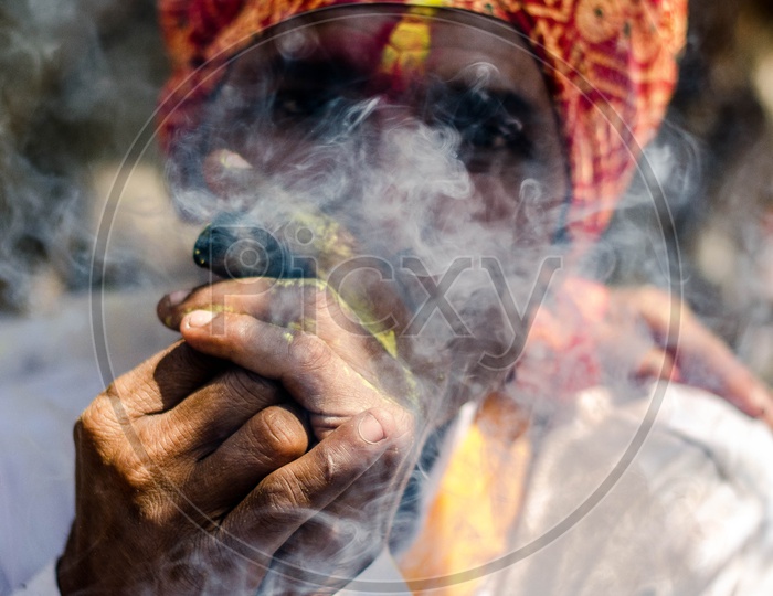Indian Hindu Sadhu Or Baba  Smoking Ganja Or Weed