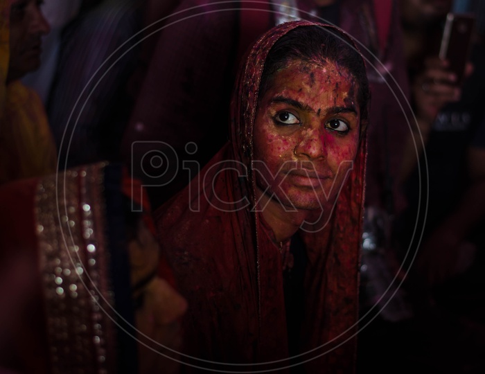 Women with coloured face in Barsana