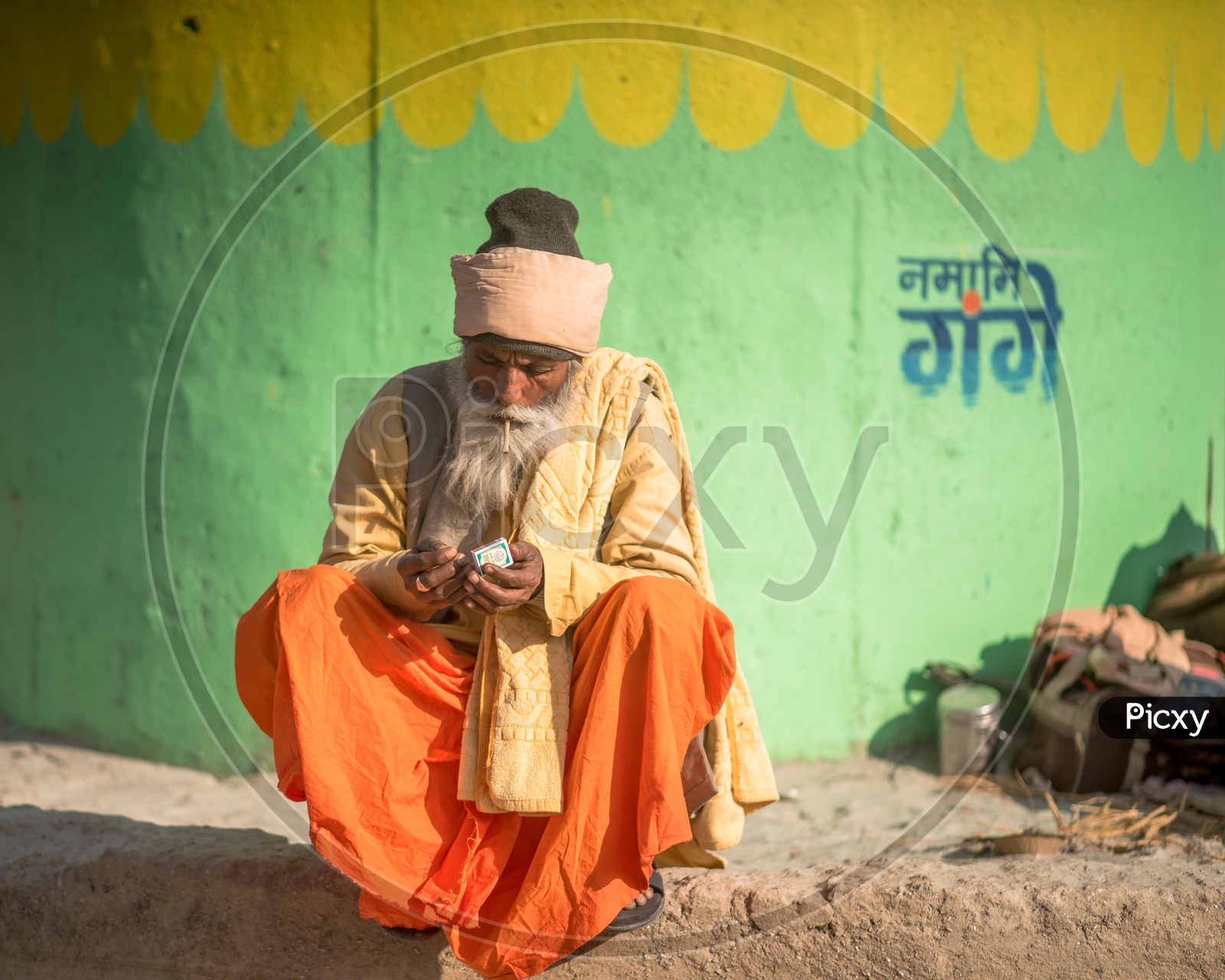 Indian Hindu Sadhus or Babas  in Kumbh Mela smoking Beedi