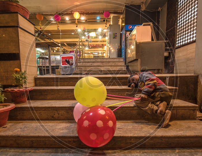 A Street Vendor Of Color Balloon