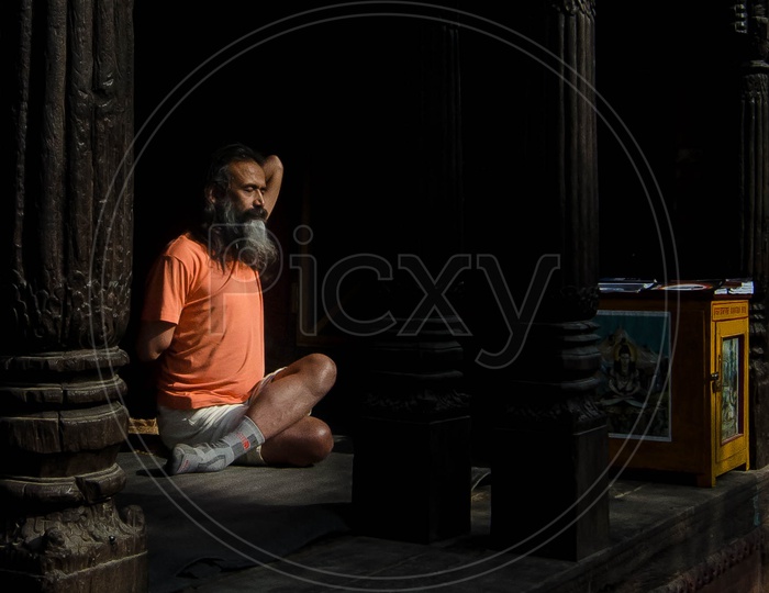 An Indian Sadhu Or Baba Practicing Yoga Aasanas