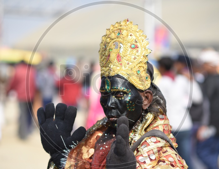 A Woman In Indian Goddess Kali Attire In Kumbh Mela
