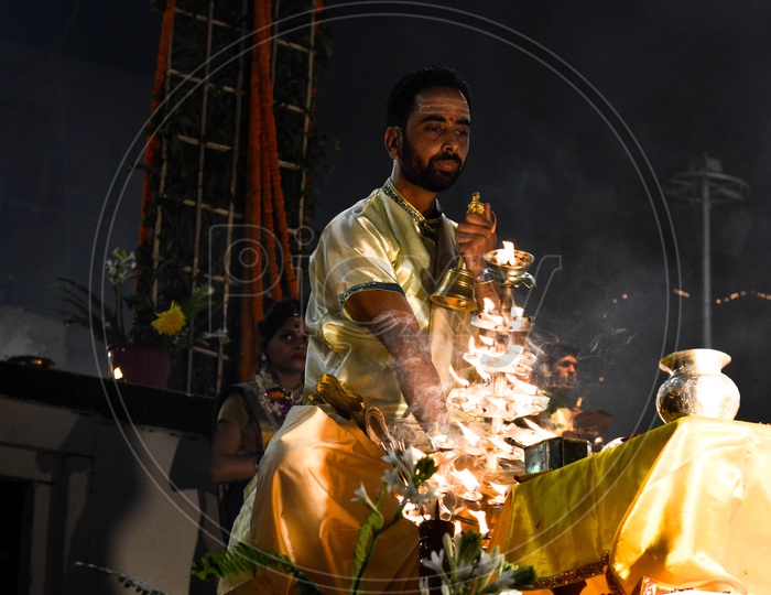 Priests Performing Ganga Haarathi Or Aarthi