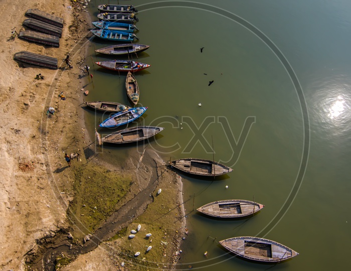 Commuting Boats Anchored on River Bank