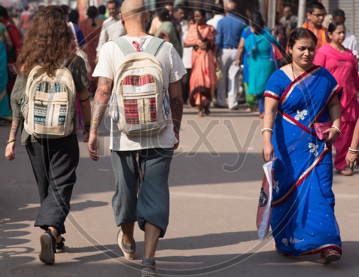 Foreigners Couple Walking along The Streets In Kumbh Mela