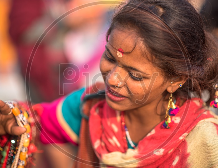 A Young Girl Vendor in Kumbh Mela