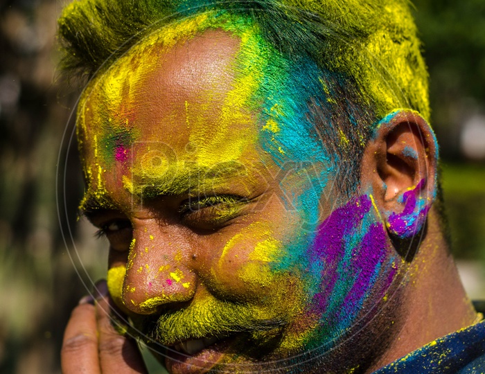 Portrait of a men with coloured face