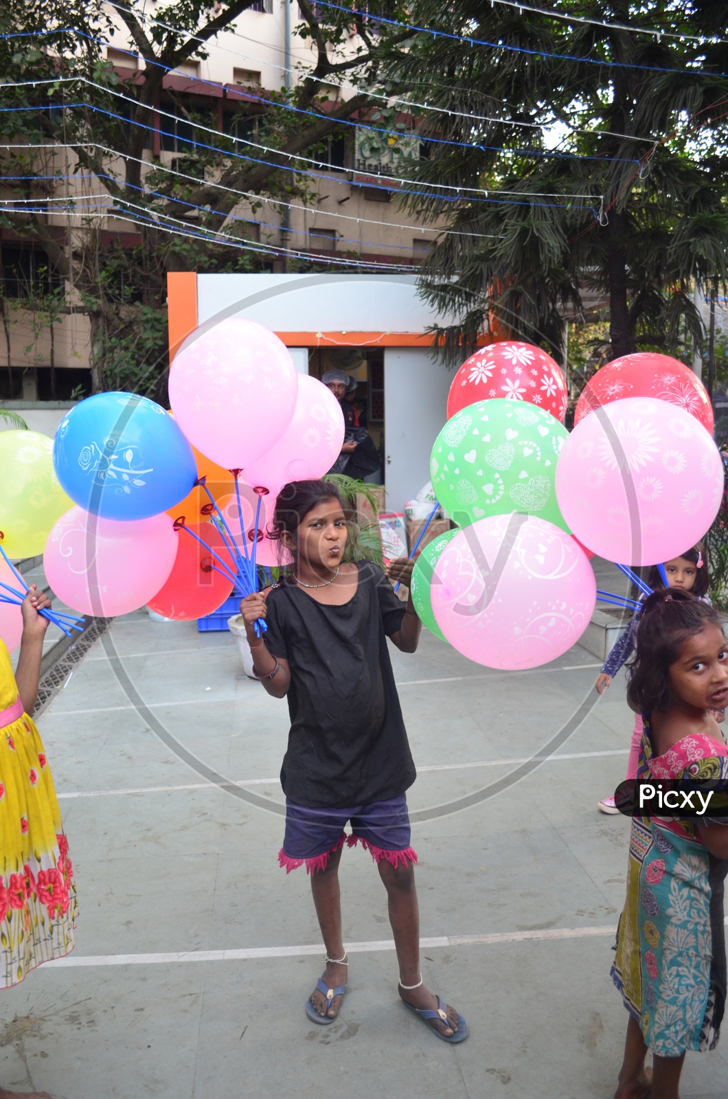 Indian Children Vendors Of Balloons  On Streets