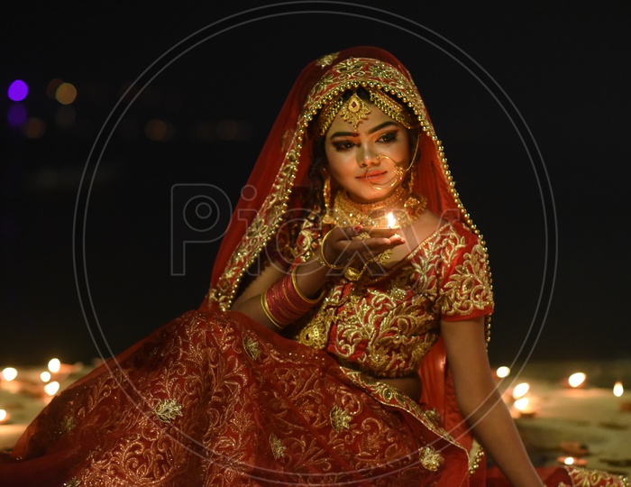 A Traditional Indian Woman  In Elegant Look With Diwali Dias and Posing