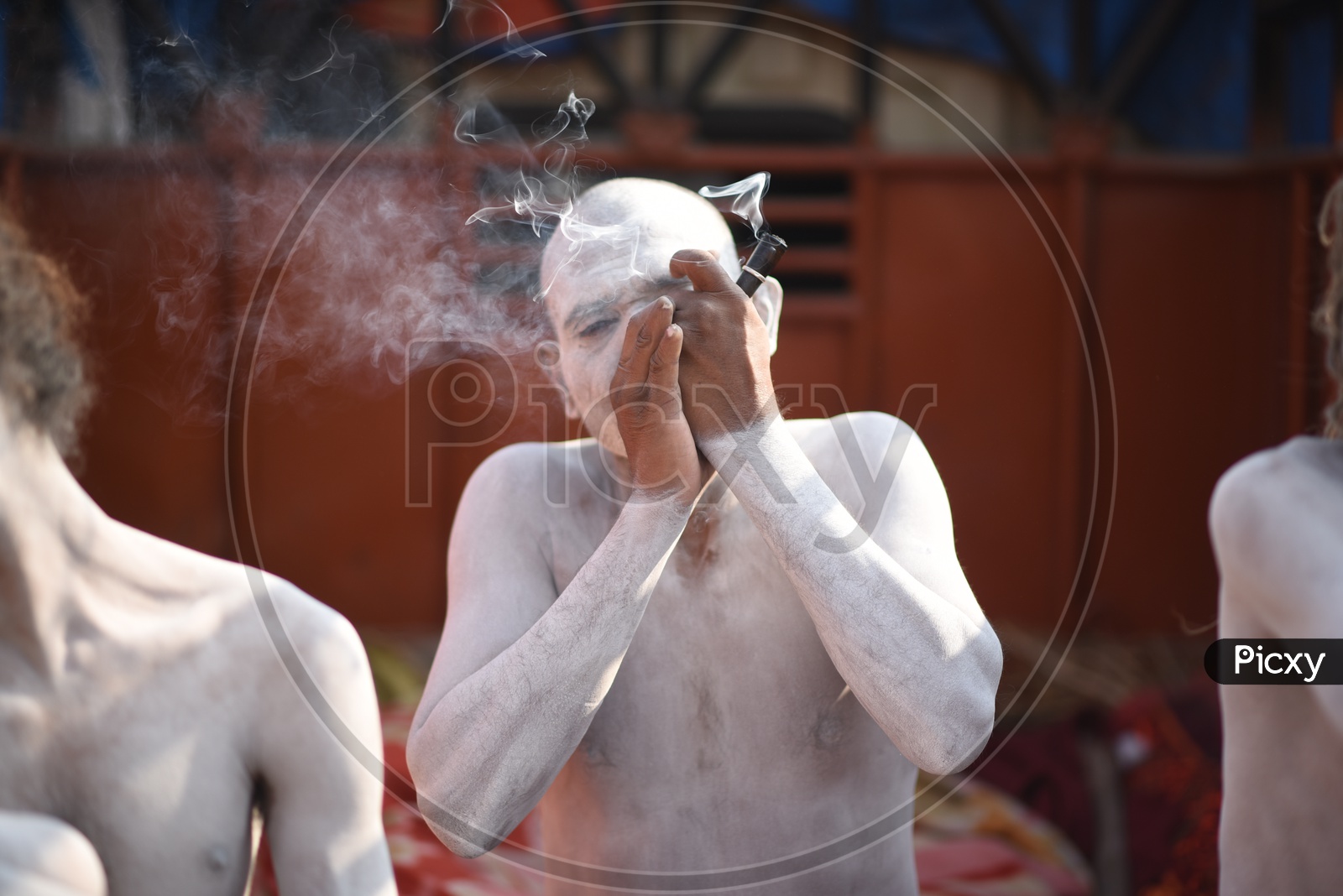 Indian Naga Sadhus Or Babas Or Aghoras Smoking Weed or Ganja   at Kumbh Mela