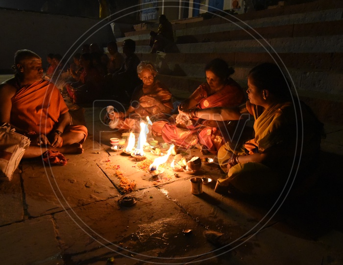 Indian Hindu Devotees Lighting  Festival Dias At Temple Premise