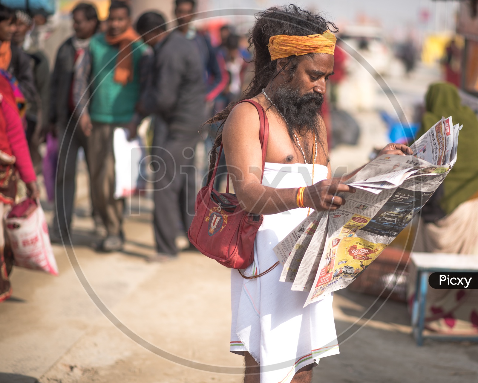 Indian Naga Sadhus Or Babas Or Aghoras   Reding Paper at Kumbh Mela