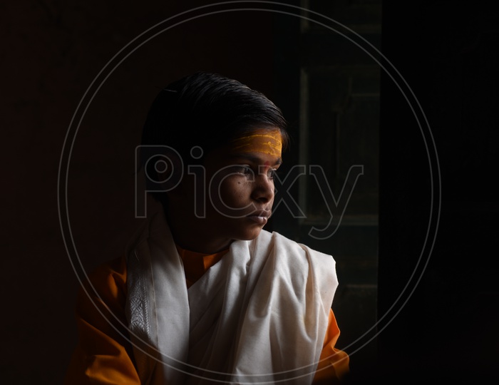 Portrait Of  A Young Indian Boy Priest