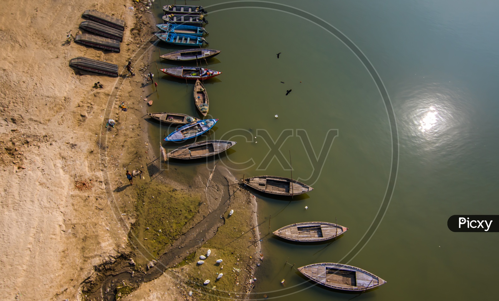 Commuting Boats Anchored on River Bank