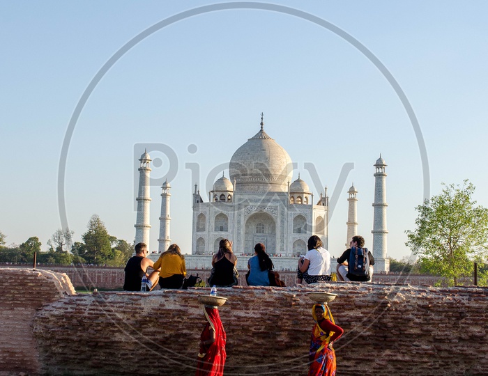 Visitors And Locals At Taj Mahal