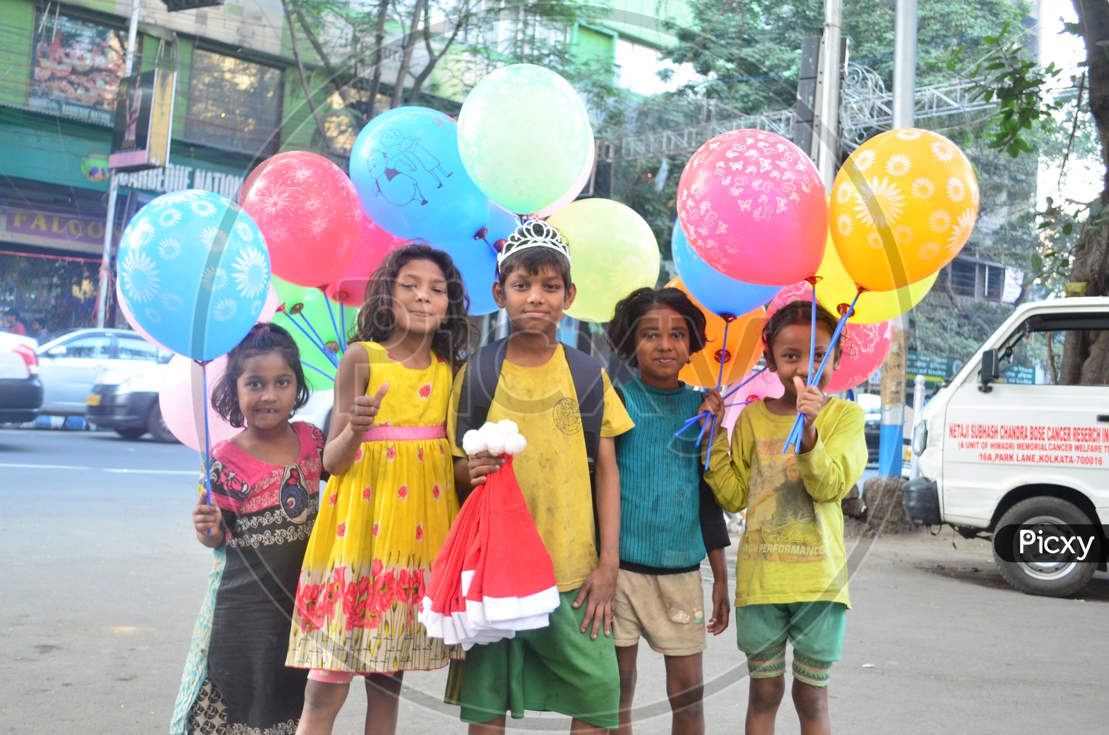 Children Vendors Of Color Balloons In Streets of India