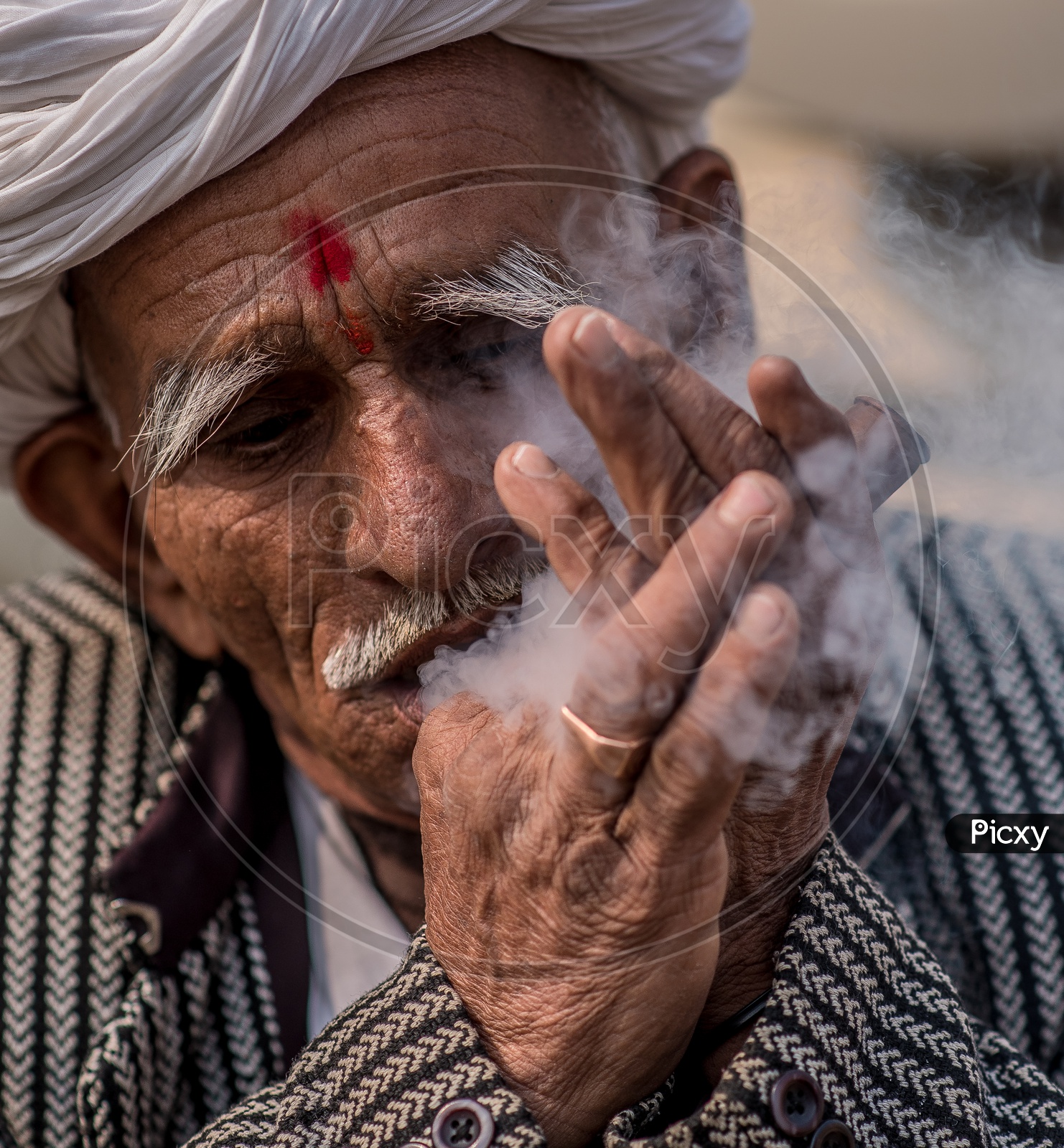 An Indian Old Man  Smoking  Ganja Or marijuanas  or weed