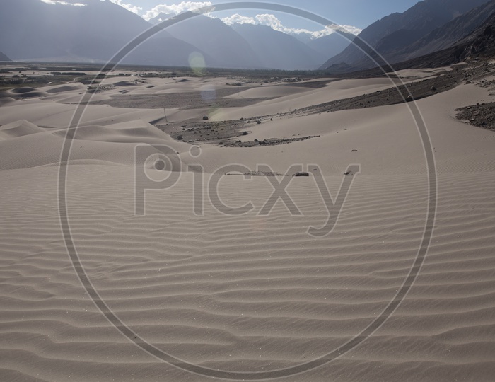 Sand Dunes In the River Valleys Of Nubra With Mountain Ranges In Background