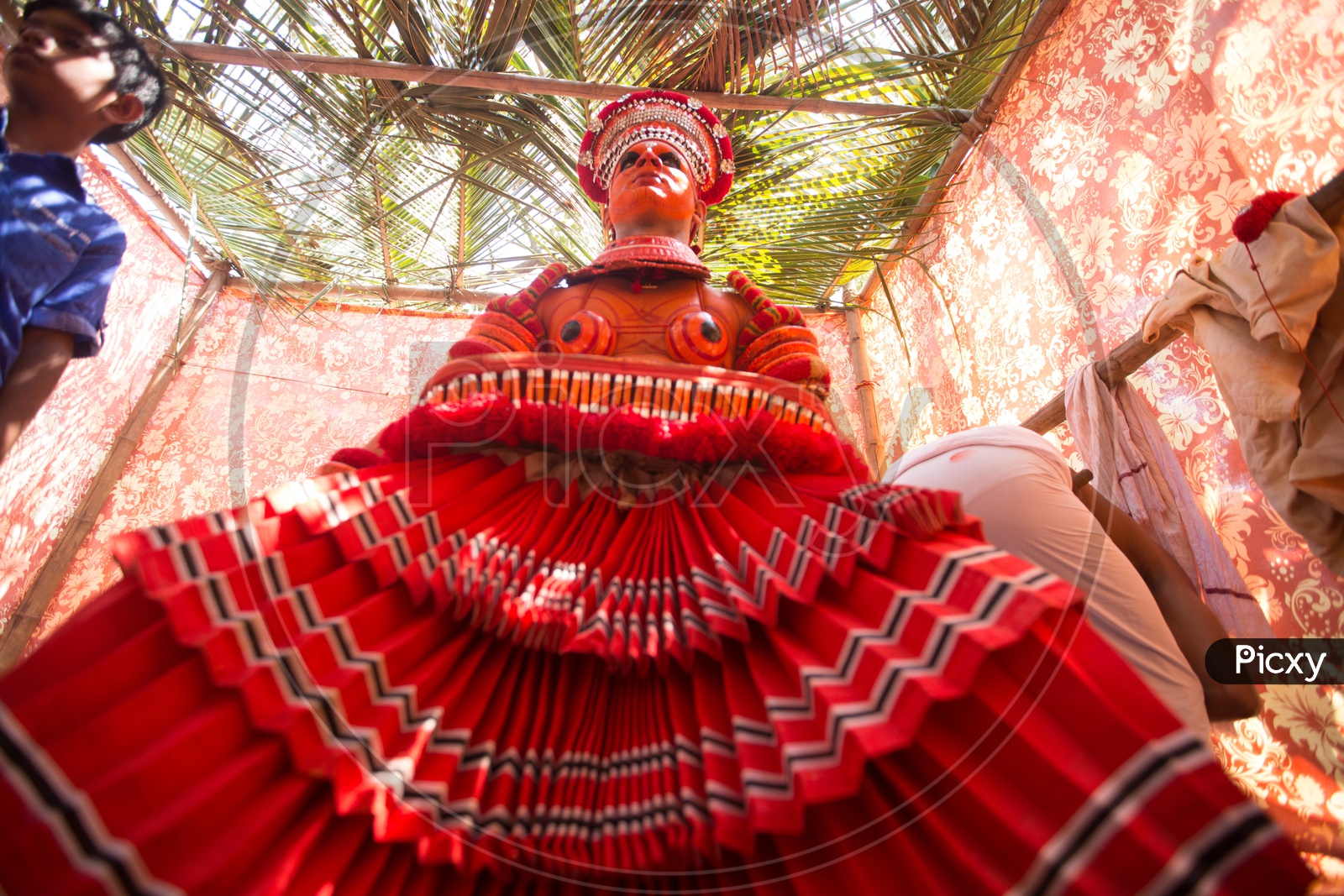 A Theyyam performer in colourful costume