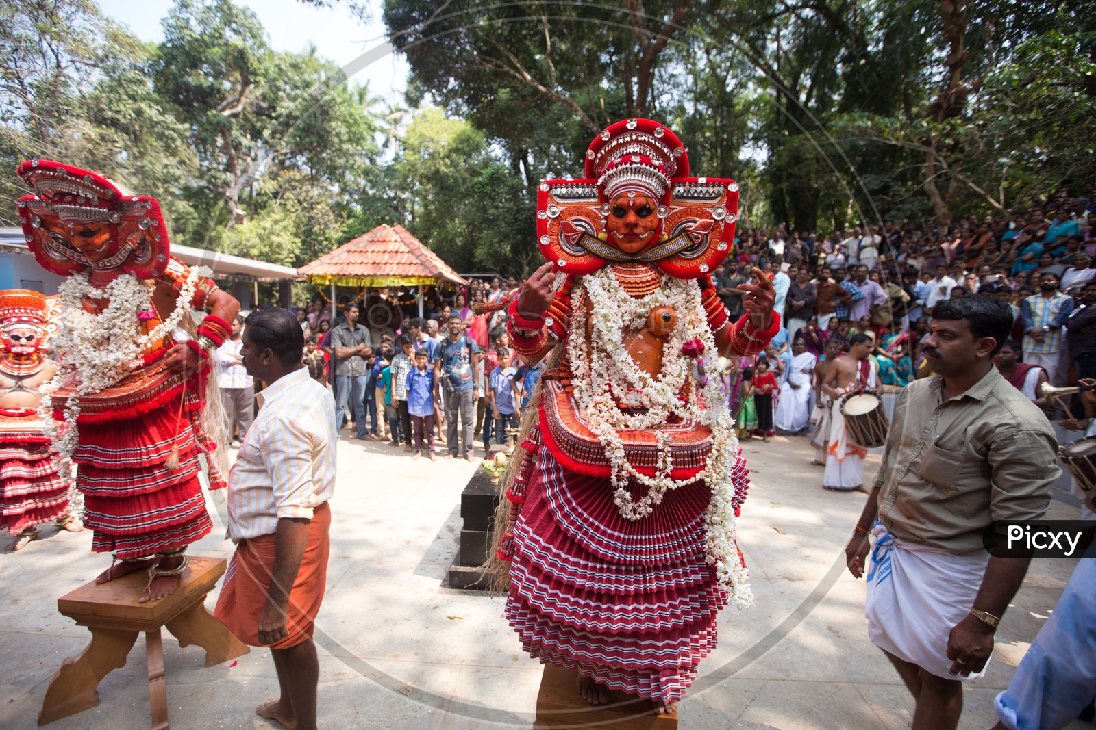 Performers in colourful costume during the performance of Theyyam