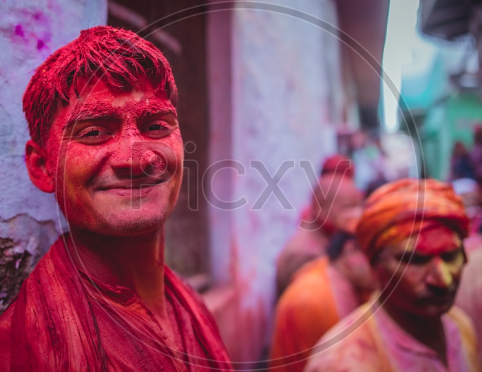 Man's face covered in Holi colors