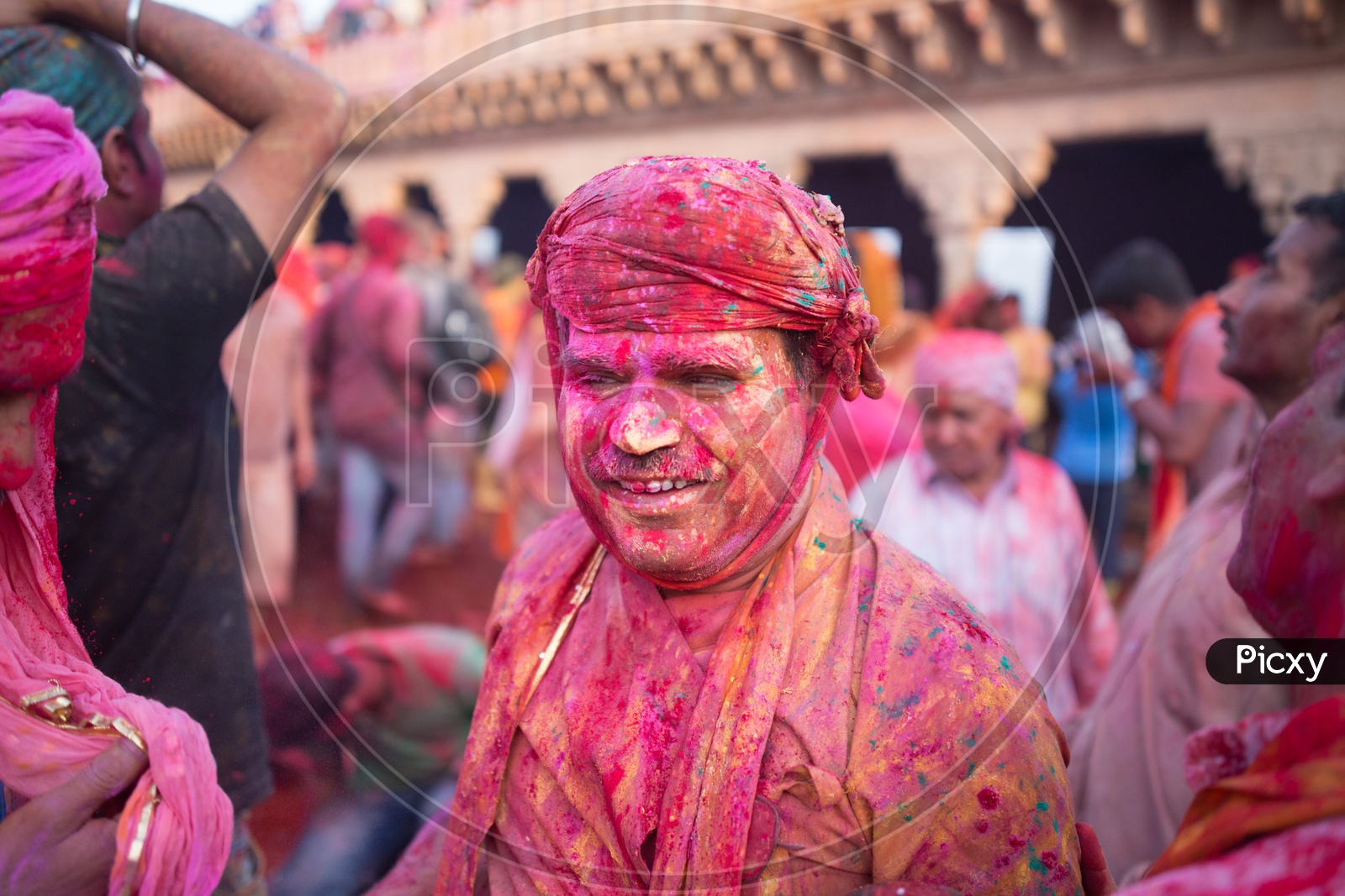 A local man covered with festive Holi colors