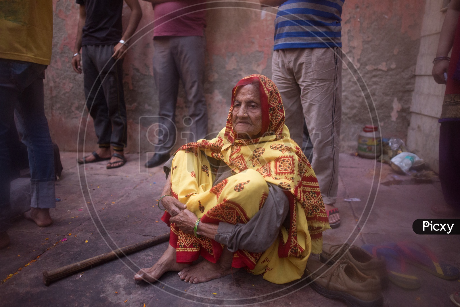 An old Indian woman sitting on the floor