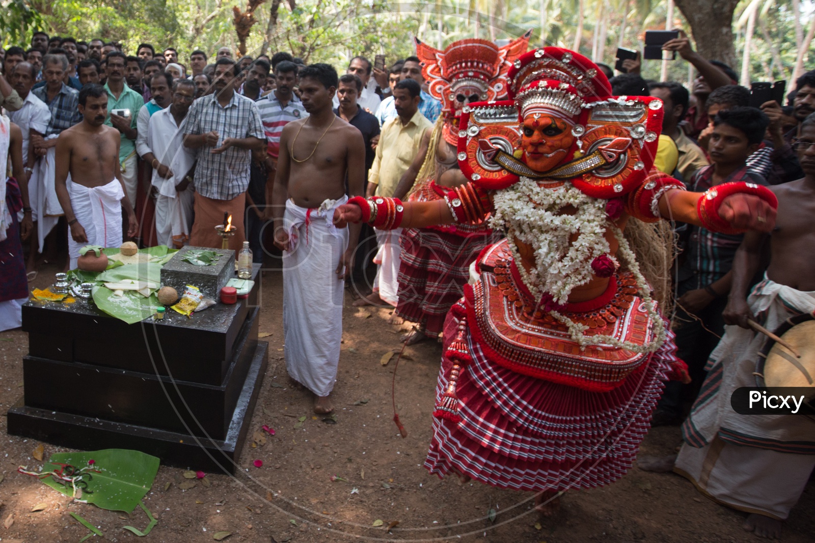 Artists Performing Theyyam , A Popular Ritual Dance Art Form  Of Kerala