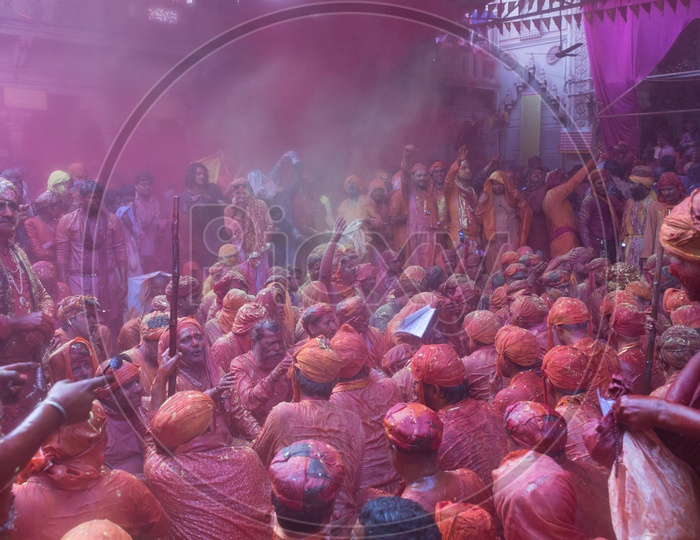 Local People In Barsana Celebrating Lathmar Holi as a Crowd Singing Songs  With Color And Water Spalsh