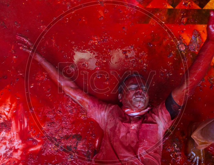 A man got drenched in festive Holi colors during celebrations in Barsana