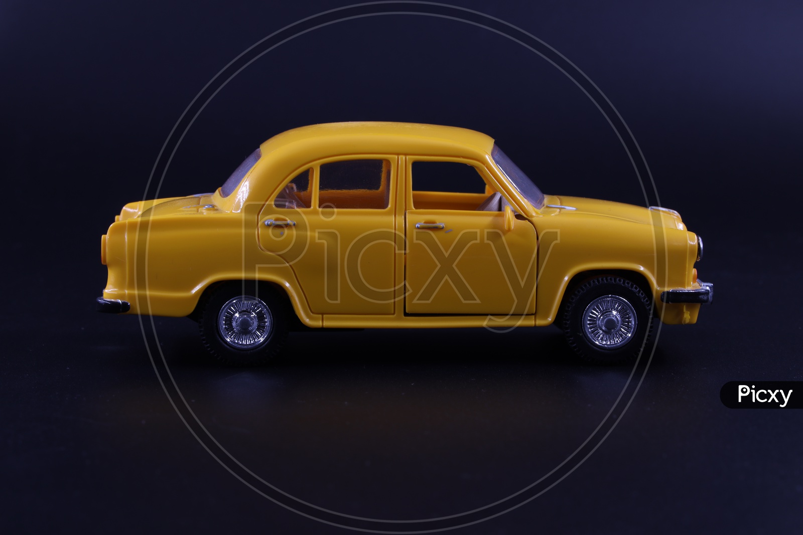 A Yellow Taxi  Or Cab or Car  Toy  Composition Shot On an Isolated Black Background