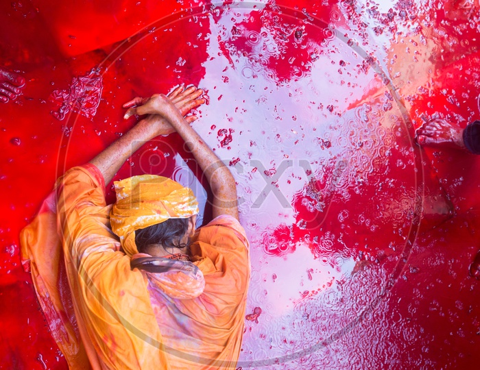 A man got drenched in festive Holi colors during celebrations