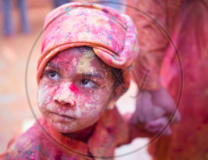 Child's face covered with Holi colors