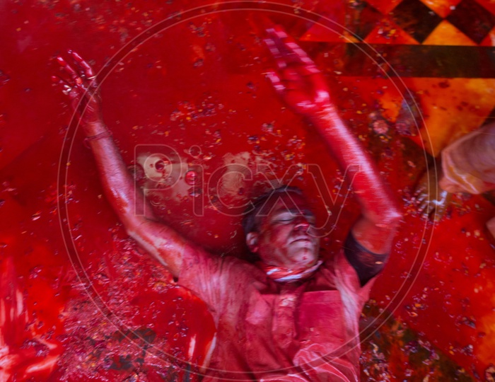 A man got drenched in Holi colors in Barsana