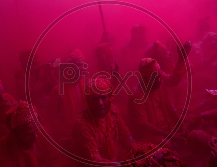 Color Splash On Crowd  in Lathmar Holi Festival  in  Barsana