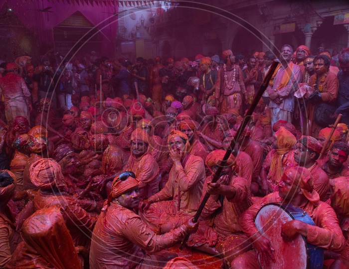 People Filled In Colors Celebrating Lathmar Holi  In Barsana