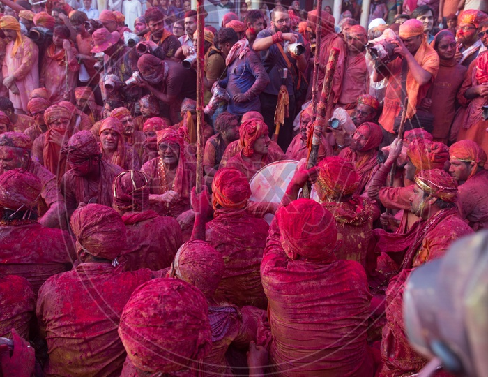 People celebrating Holi festival in Nandgaon