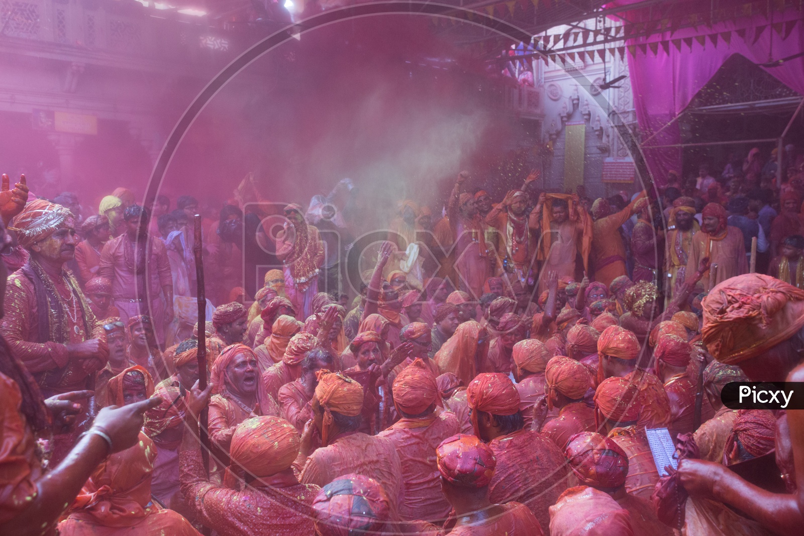 Local People In Barsana Celebrating Lathmar Holi as a Crowd Singing Songs  With Color And Water Spalsh