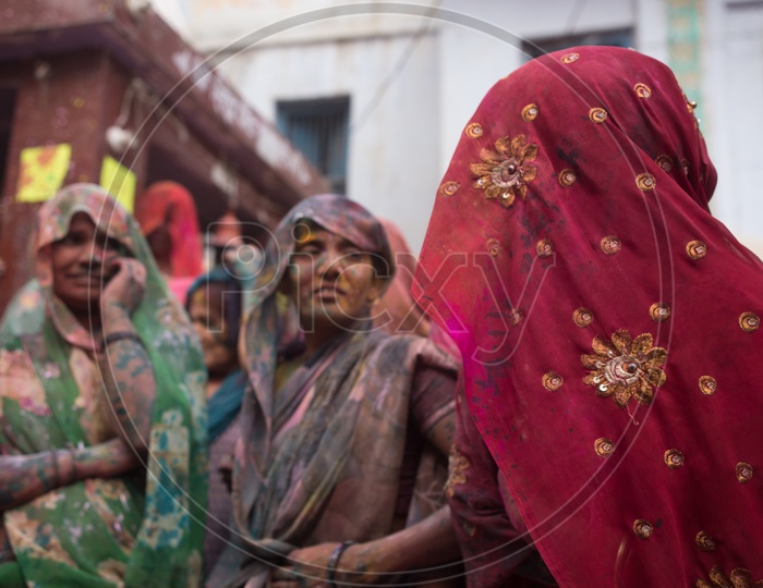 Woman Filled In Colors Celebrating Holi in Barsana Streets